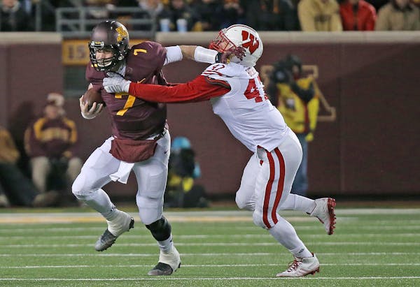 Minnesota's quarterback Mitch Leidner was sacked by Wisconsin's linebacker Vince Biegel in the third quarter as Minnesota took on Wisconsin at TCF Ban