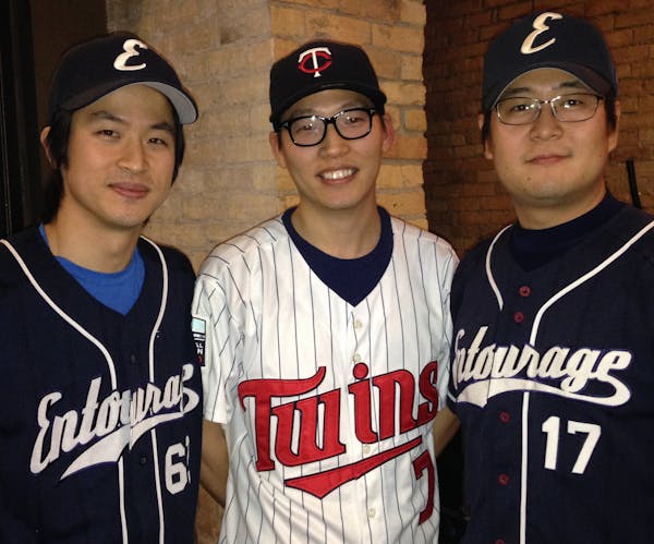 Sangho Yun, center, is a Twins fan. His buddies, Kiwoong You, left, and Kwan Hyun Kim play for a Korean amateur team.