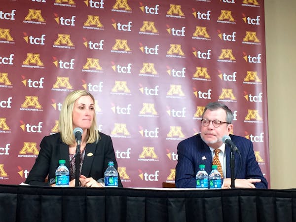 University of Minnesota President Eric Kaler, right, with interim A.D. Beth Goetz, seeks a strong “tone at the top” in a new athletic director.