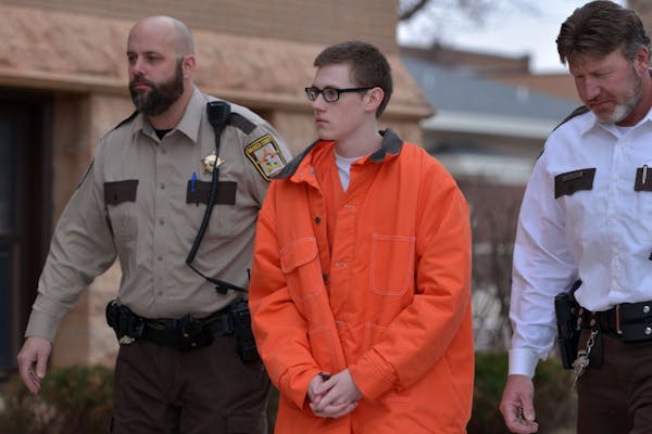 John LaDue is escorted from the Waseca Sheriff's Office into the Waseca County Courthouse Friday morning for a hearing regarding a secure facility in 