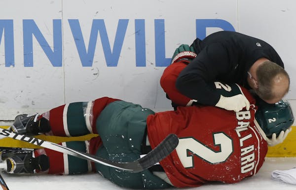Defenseman Keith Ballard was knocked to the ice during a game against the New York Islanders at the X on Dec. 9, 2014. He never played again.