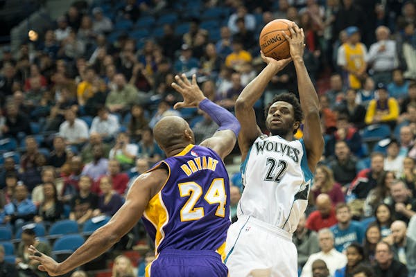Minnesota Timberwolves guard Andrew Wiggins (22) hit a shot over Los Angeles Lakers forward Kobe Bryant (24) in the first quarter.