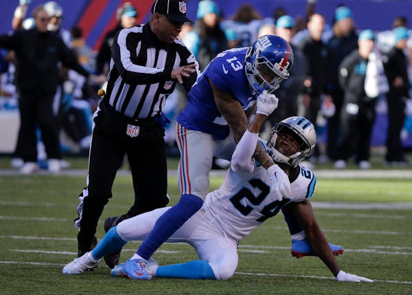 An official stepped in to separate Giants wide receiver Odell Beckham from Panthers cornerback Josh Norman during one of their many scuffles Sunday.