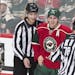 Wild left winger Zach Parise (11) laughed with officials after the puck disappeared into his jersey, temporarily haulting a Wild power play late in th
