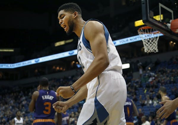 Wolves center Karl-Anthony Towns reacted after scoring in the first quarter against the Suns on Sunday.