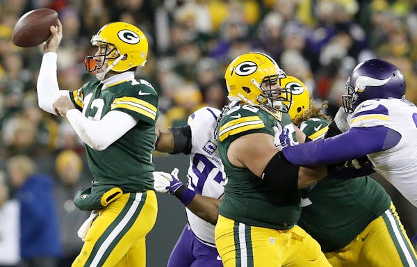 Everson Griffen (97) sacked Aaron Rodgers (12) forcing a fumble that was picked up by Captain Munnerlyn and returned for a touchdown in the third quar