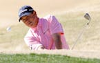 Jason Dufner hits out of the bunker at the second green during the final round of the CareerBuilder Challenge golf tournament on the TPC Stadium cours