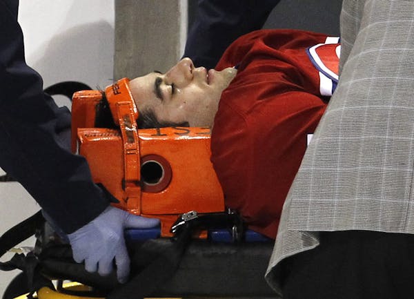 All torn up: Canadiens’ star Max Pacioretty was carted off the ice after taking a hit in 2011. Though he is not a plaintiff in the case unfolding in