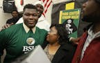 Josh Wleh hugged his mom Vesta Wleh after he signed his letter to play football at Bemidji State University Wednesday Feb 03, 2016 in Brooklyn Park, M