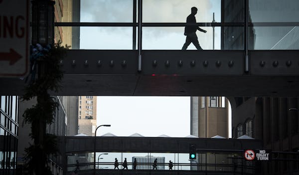 Pedestrians passed over S. 8th Street in downtown Minneapolis. When skyways to the new Wells Fargo buildings and U.S. Bank Stadium open, the system wi