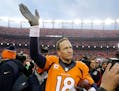 Broncos quarterback Peyton Manning waved to spectators following the AFC Championship Game on Sunday. The Broncos defeated the Patriots 20-18 to advan