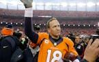 Broncos quarterback Peyton Manning waved to spectators following the AFC Championship Game on Sunday. The Broncos defeated the Patriots 20-18 to advan