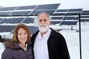 Cathy and Kevin Palmer of Blaine are offsetting all their home’s electricity with power bought from Connexus’ solar garden in Ramsey (background).