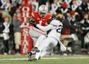 Ohio State wide receiver Braxton Miller was taken down by Gophers defensive back Briean Boddy-Calhoun in the Buckeyes' 28-14 victory on Nov. 7.