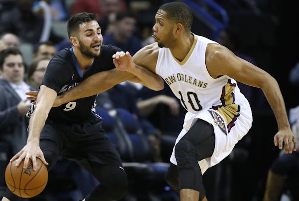 Minnesota Timberwolves guard Ricky Rubio (9) drives against New Orleans Pelicans guard Eric Gordon during the second half of an NBA basketball game Tu