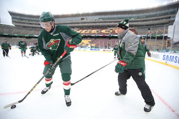 Minnesota Wild Head Coach John Torchetti took to the ice alongside Charlie Coyle for a practice before the 2016 Stadium Series Alumni game at TCF Bank