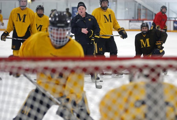 At the Mars Lakeview Arena, head coach Brendan Flaherty of Duluth Marshall oversaw practice. The school moved up to a AA schedule in spite of being sm
