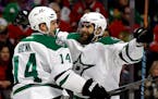 Dallas Stars right wing Patrick Eaves, right, celebrates with left wing Jamie Benn after scoring his first goal during the first period of an NHL hock