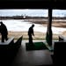 Golfers teed off at a chilly driving range in 2013.