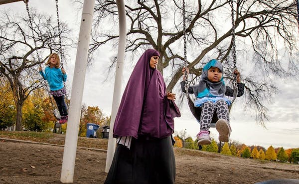 Faisa Adeys pushed her 2-year-old daughter Mumtaz in a swing in Matthews Park, Minneapolis. Minneapolis park leaders formally proposed that all city r