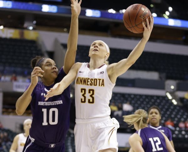 Northwestern's Nia Coffey defended a shot by Carlie Wagner during Thursday's Big ten women's basketball tournament.