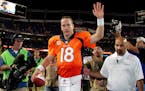 FILE - In this Sept. 5, 2013, file photo, Denver Broncos quarterback Peyton Manning (18) walks off the field after an NFL football game against the Ba
