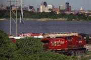 Locomotives traveled on tracks next to Hwy. 61 near the Canadian Pacific rail yard by Pig’s Eye Lake in St. Paul.