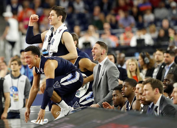 The Villanova bench reacts to play against Oklahoma during the second half of the NCAA Final Four tournament college basketball semifinal game Saturda