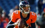 FILe - In this Jan. 3, 2016, file photo, Denver Broncos quarterback Brock Osweiler warms up during the first half in an NFL football game against the 