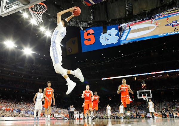 North Carolina forward Justin Jackson (44) dunks the ball on Syracuse during the second half of the NCAA Final Four tournament college basketball semi
