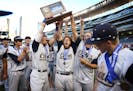 Chanhassen players celebrate their 2-0 win over Lakeville North for the 3A state championship at Target Field in Minneapolis on Monday, June 15, 2015.