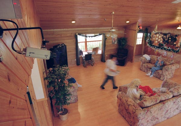 A video camera records the daily activities in the common room of the Southland Suites assisted living community Friday, March 16, 2001, in Lake City,