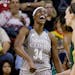 Minnesota Lynx's Sylvia Fowles (34) reacts after scoring and being fouled on the shot by Seattle Storm's Breanna Stewart, right, in the second half of