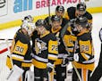 Pittsburgh Penguins goalie Matt Murray (30) is congratulated by Pittsburgh Penguins Patric Hornqvist (72) after the Penguins defeated the Washington C