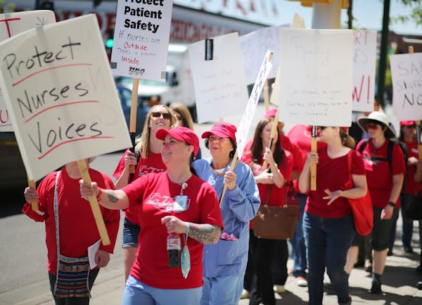 Nurses with Allina Health held an informational picket outside the Allina Commons at the Global Market Wednesday, May 18, 2016, in Minneapolis.