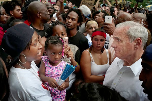 Governor Mark Dayton met with family members including Diamond Reynolds and her daughter, far left.