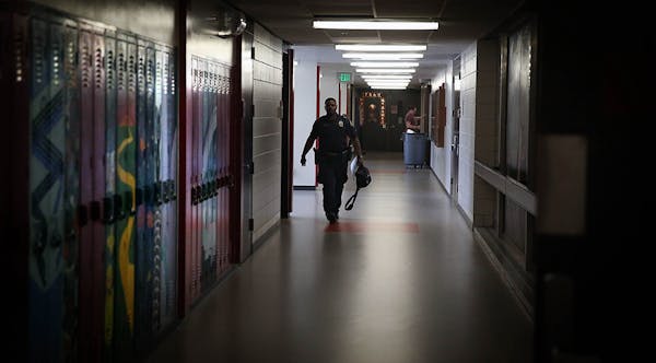 Cortez Hull, school resource officer (SRO) at Highland Park High School in St. Paul. The St. Paul school board will meet to discuss the future of its 