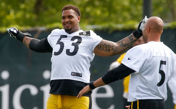 Pittsburgh Steelers center Maurkice Pouncey (53) and quarterback Bruce Gradkowski (5) stretch at the start of NFL football practice, Tuesday, May 31, 