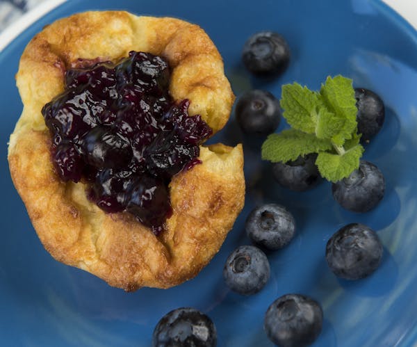 Finished Dutch Puff with blueberry compote, blueberries, and basil. ] Isaac Hale ï isaac.hale@startribune.com Baking Central: Making Dutch Puffs in m