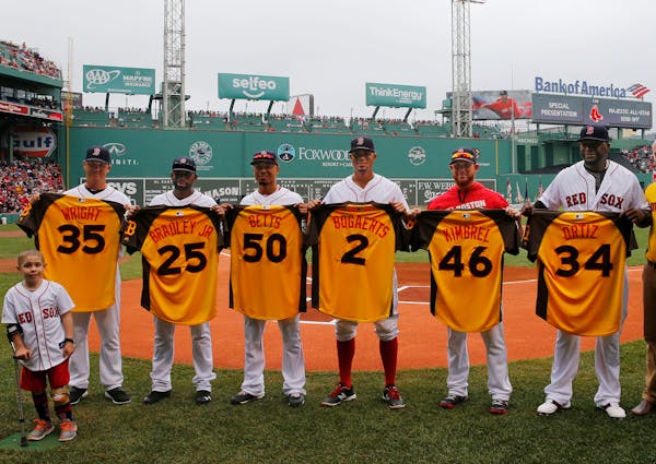 Boston Red Sox All-Star selections, left to right, starting pitcher Steven Wright, center fielder Jackie Bradley Jr., right fielder Mookie Betts, shor