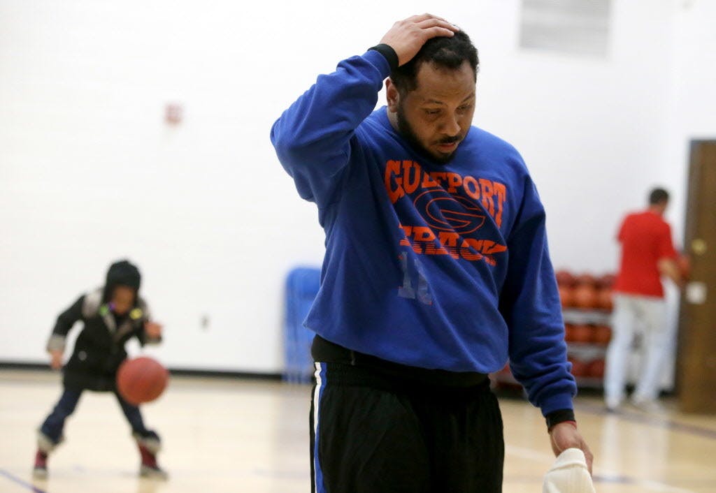 Having been going since early morning, single father Kendrick Bates ran low on energy while volunteering as a Special Olympics basketball coach in the evening. He also works as a substitute teacher and is working to finish his bachelor's degree.