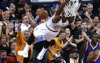Fans cheer as Cleveland Cavaliers forward LeBron James (23) dunks against the Golden State Warriors during the second half of Game 6 of basketball's N