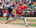 Los Angeles Angels pitcher Tim Lincecum throws to the Oakland Athletics during the first inning of a baseball game, Saturday, June 18, 2016, in Oaklan