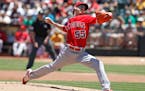 Los Angeles Angels pitcher Tim Lincecum throws to the Oakland Athletics during the first inning of a baseball game, Saturday, June 18, 2016, in Oaklan