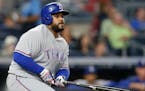 FILE - In this Tuesday, June 28, 2016 file photo Texas Rangers' Prince Fielder watches his eighth-inning RBI double during a baseball game against the