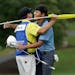 Si Woo Kim, right, hugs his caddie after winning the Wyndham Championship golf tournament in Greensboro, N.C., Sunday, Aug. 21, 2016. (AP Photo/Chuck 