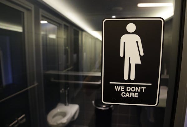 In this Thursday, May 12, 2016 file photo, signage is seen outside a restroom at 21c Museum Hotel in Durham, N.C.