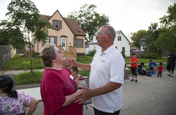 Hennepin County Attorney Mike Freeman spoke with neighbor Chris Billings on the 4000 block of Aldrich Avenue N. during National Night Out.