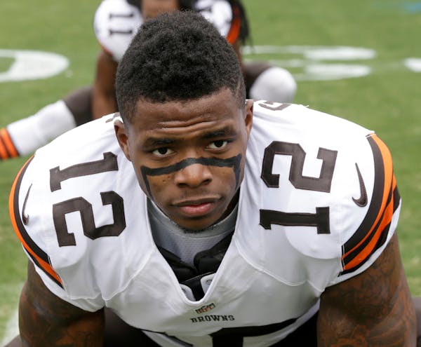 FILE - In this Dec. 21, 2014, file photo, Cleveland Browns' Josh Gordon (12) stretches before an NFL football game against the Carolina Panthers in Ch