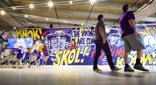 Minneapolis-based artist Greg Gossell used a lively pop-art style in his 25-yard-long mural “The Vikings Are Coming” in a concourse of the new U.S